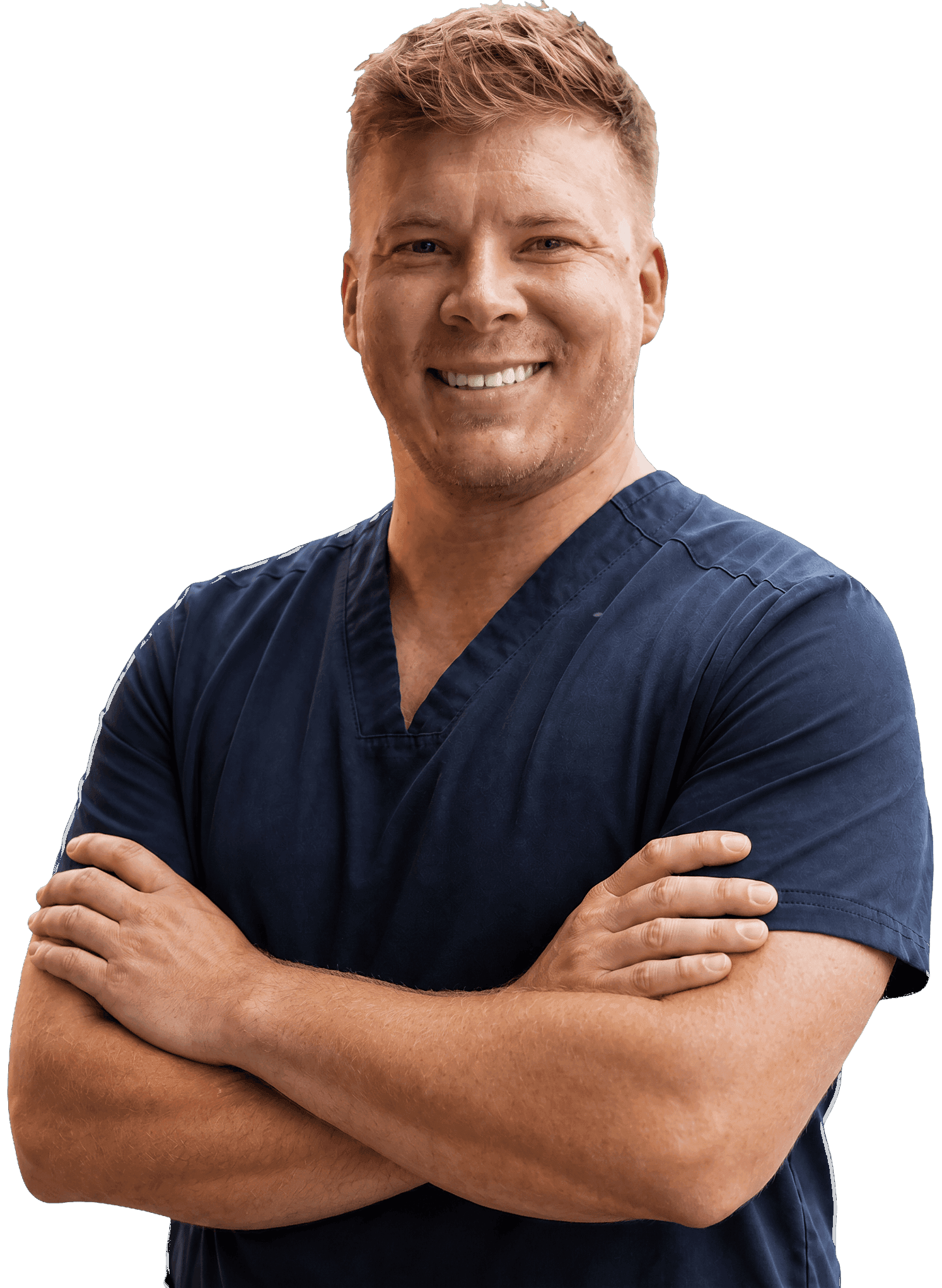 Dr. Kyle McDonald in navy scrubs, arms crossed.